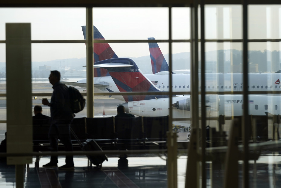 Passengers walk through the airport terminal at Ronald Reagan