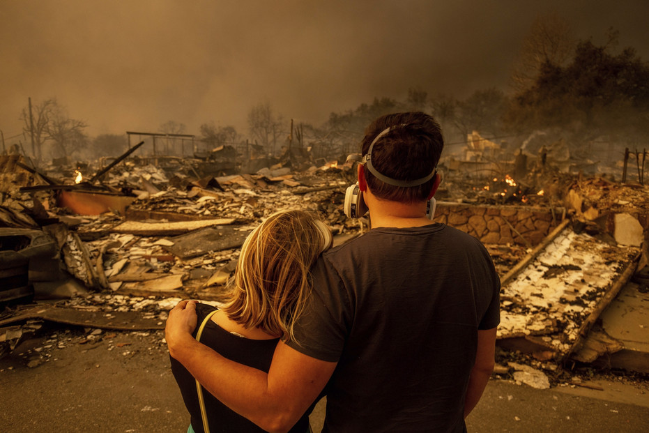 A couple looks at their destroyed home after the Eaton Fire swept through Altadena, California, last month. A couple looks at their destroyed home after the Eaton Fire swept through Altadena, California, last month.