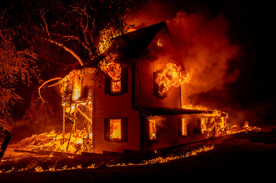 A home burns during the Dixie wildfire near Janesville, Calif., in August.