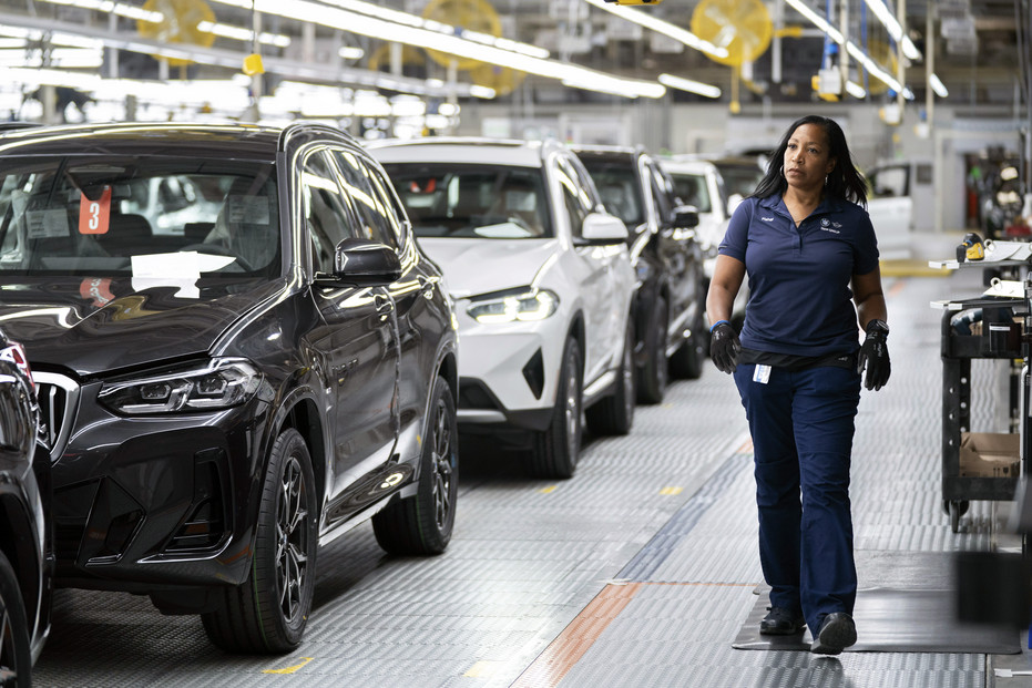 FILE - An employee works in the X3, X45 assembly hall at the BMW Spartanburg plant in Greer, S.C., Oct. 19, 2022. With inflation a top concern for voters, many Republican candidates are seeking to capitalize on Americans’ precarious financial situations heading into next week’s midterm elections to vilify a key component of President Joe Biden’s climate agenda: electric vehicles. (AP Photo/Sean Rayford, File)