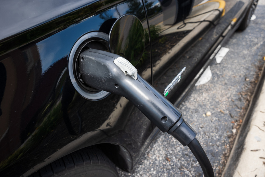 A Ford Fusion Energi Platinum is charged at a Volta EV charging station in Alexandria, Va., Aug. 19, 2021.