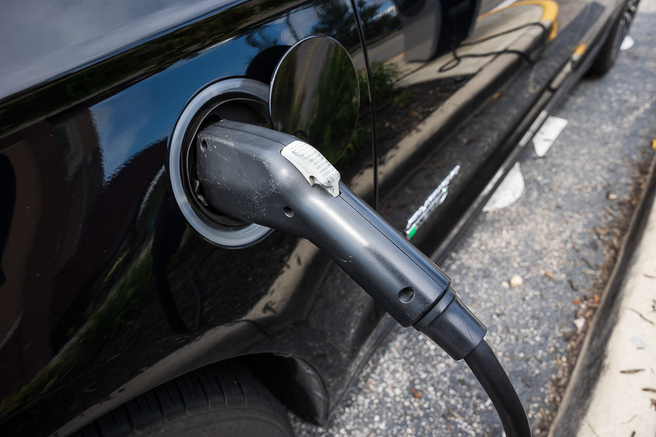 A Ford Fusion Energi Platinum is charged at a Volta EV charging station in Alexandria, Va., Aug. 19, 2021. A Ford Fusion Energi Platinum is charged at a Volta EV charging station in Alexandria, Va., Aug. 19, 2021.