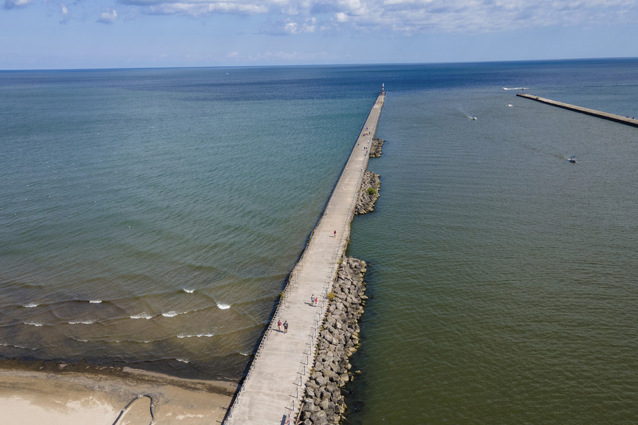People walk on the Charlotte Pier at Ontario Beach Park on Lake Ontario in Rochester, New York, is visible. People walk on the Charlotte Pier at Ontario Beach Park on Lake Ontario in Rochester, New York, is visible.