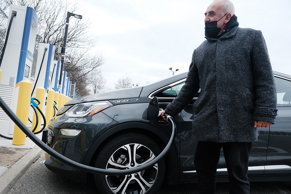 A driver uses a fast-charging station for electric vehicles last year in the cell phone lot at John F. Kennedy airport in New York City. A driver uses a fast-charging station for electric vehicles last year in the cell phone lot at John F. Kennedy airport in New York City.