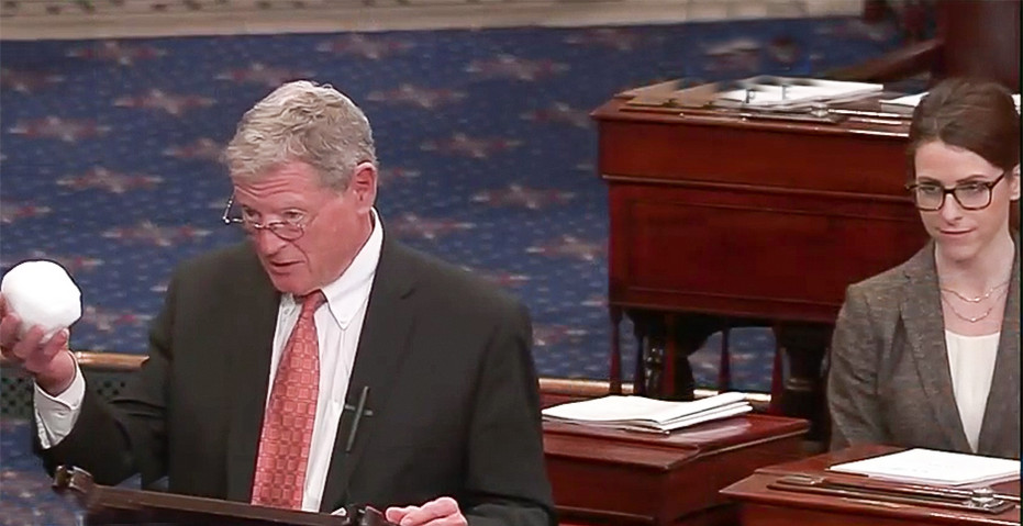 Mandy Gunasekara watches as her then-boss Sen. Jim Inhofe (R-Okla.) holds a snowball in the Senate chamber in 2015.